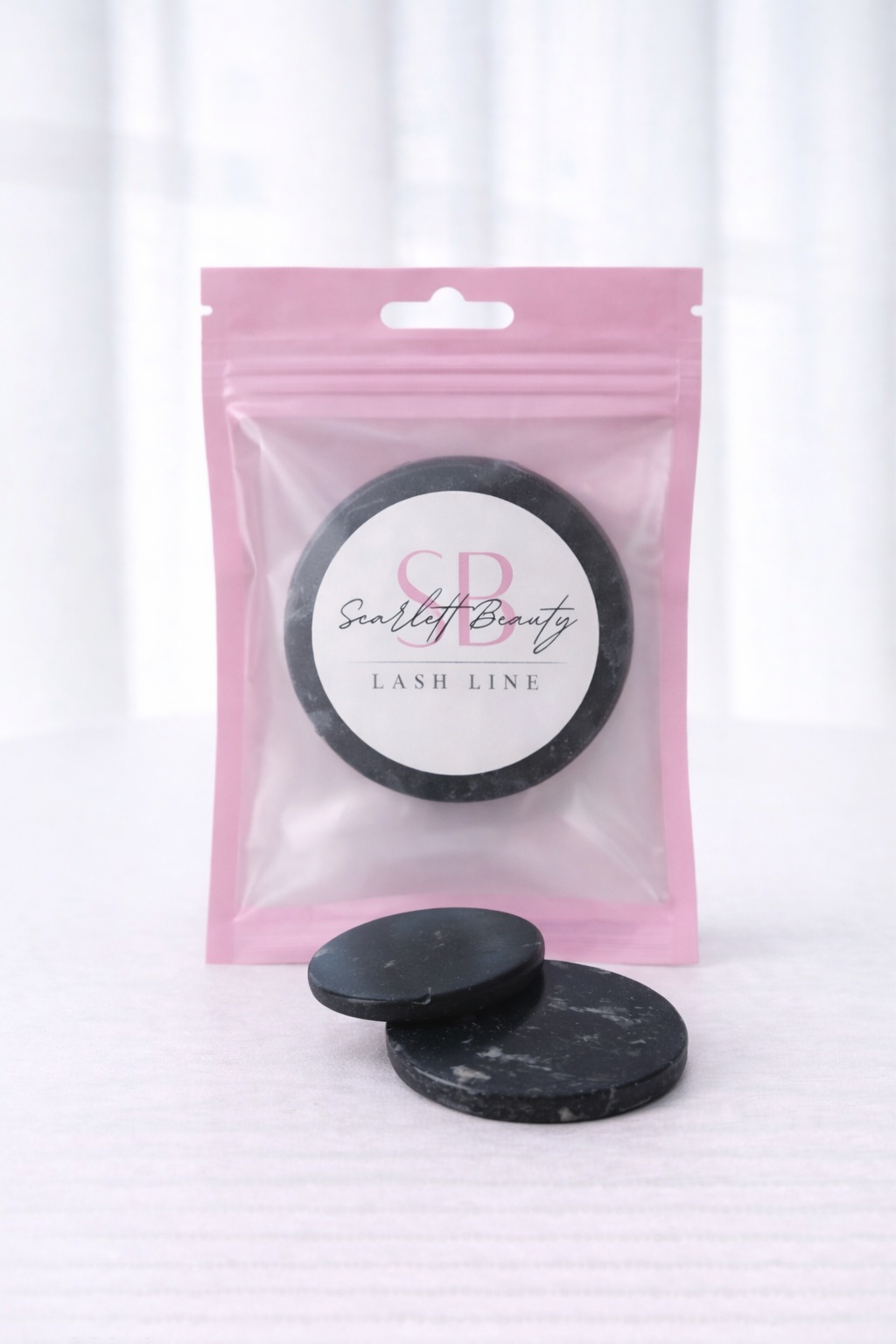 A Glue Stone provides a smooth, cool surface for holding lash adhesive during lash extension applications.