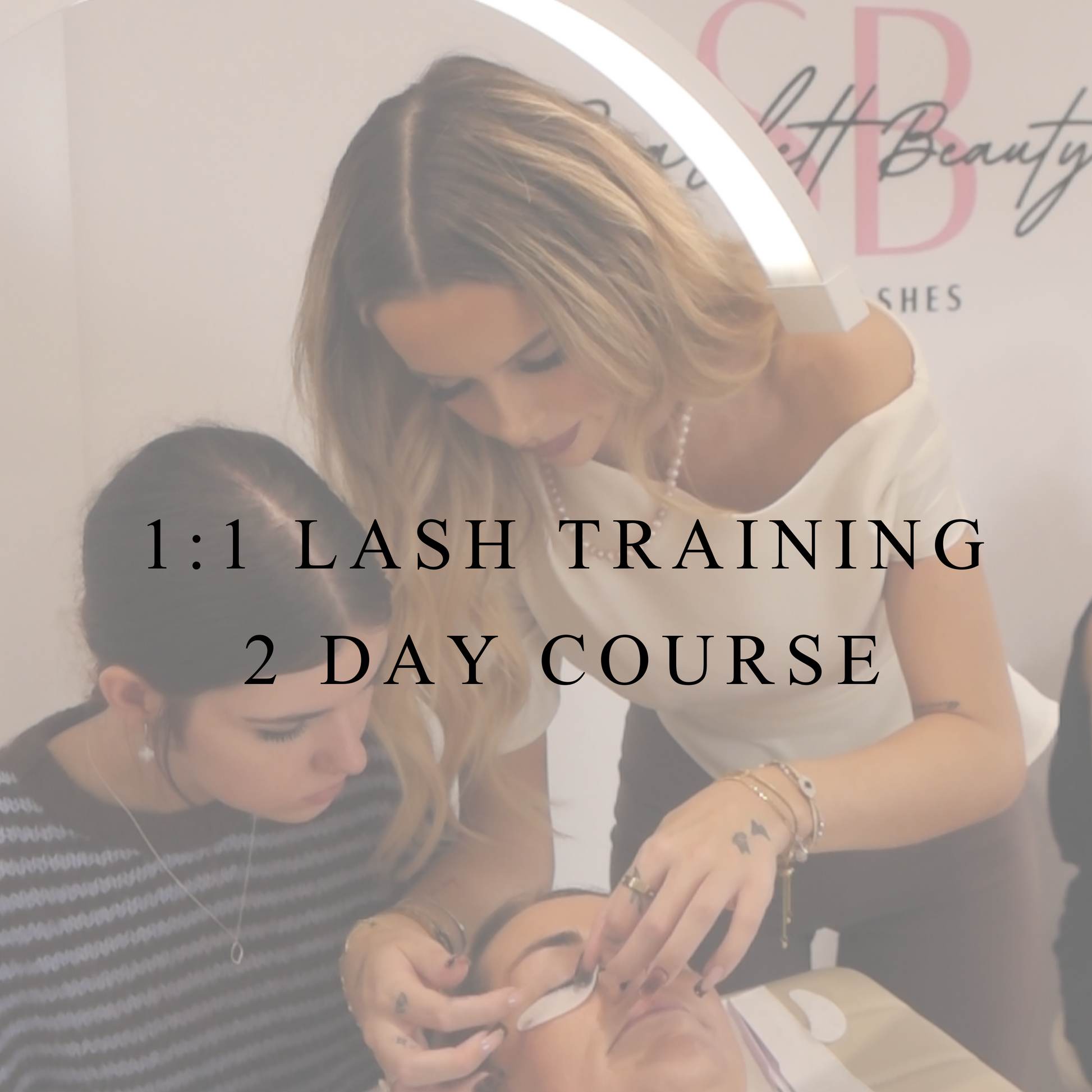 1:1 lash extension training course at scarlett beauty academy with instructor guiding a student during a live ash application
