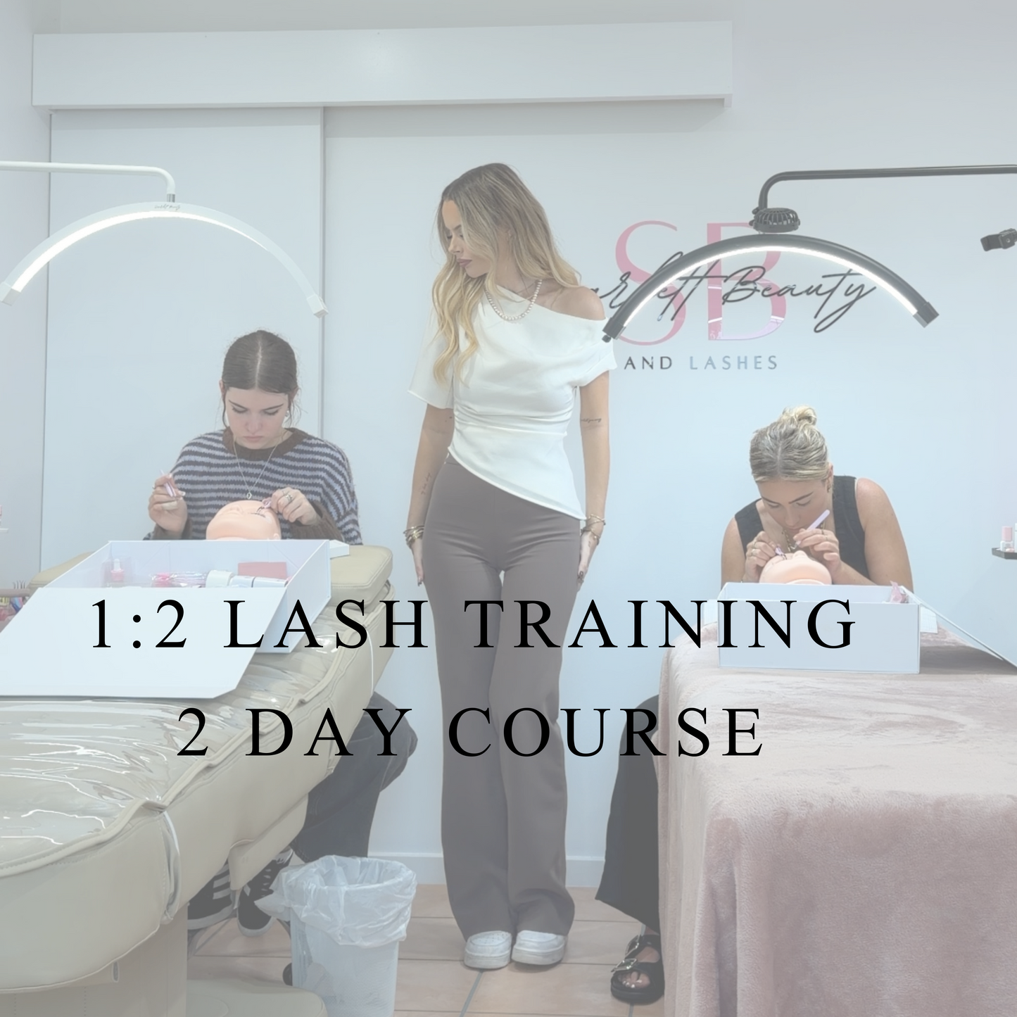 1:2 lash training course at scarlett beauty acadey with instructor supervising two students practcing lash extensions 