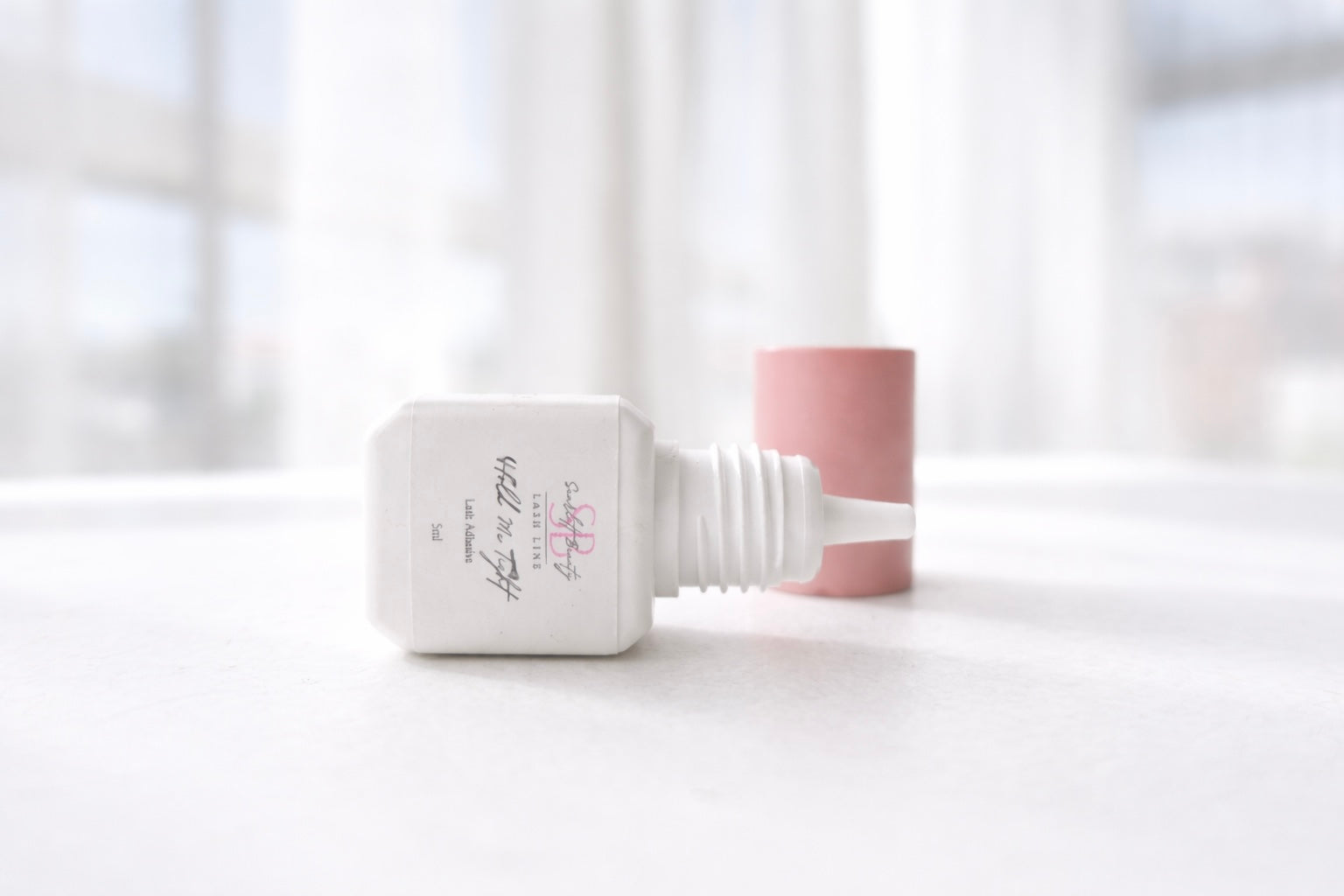 Hold Me Tight Adhesive is a professional lash extension glue designed for lash artists who want speed, reliability, and long-lasting retention.