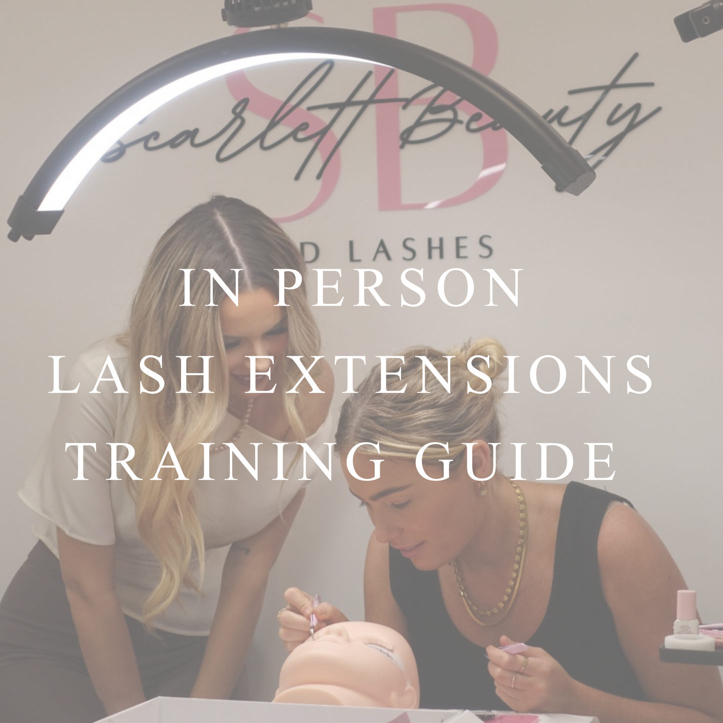in person lash extensions training session at scarlett beauty academy with instructor guiding a student. free ebook download